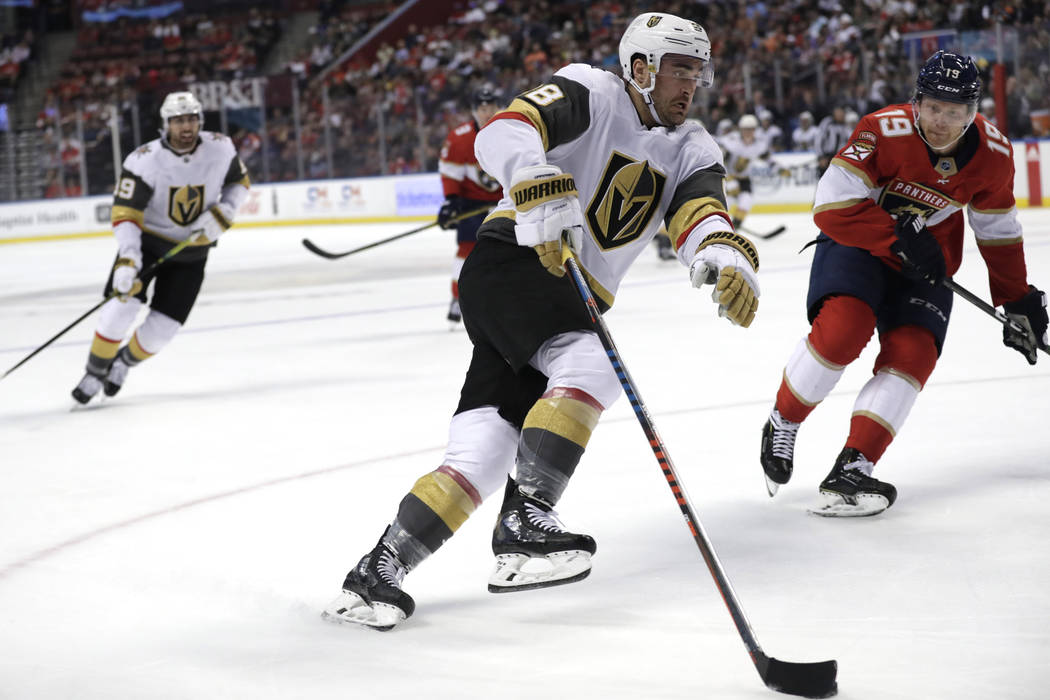 Vegas Golden Knights left wing William Carrier, left skates with the puck as Florida Panthers d ...