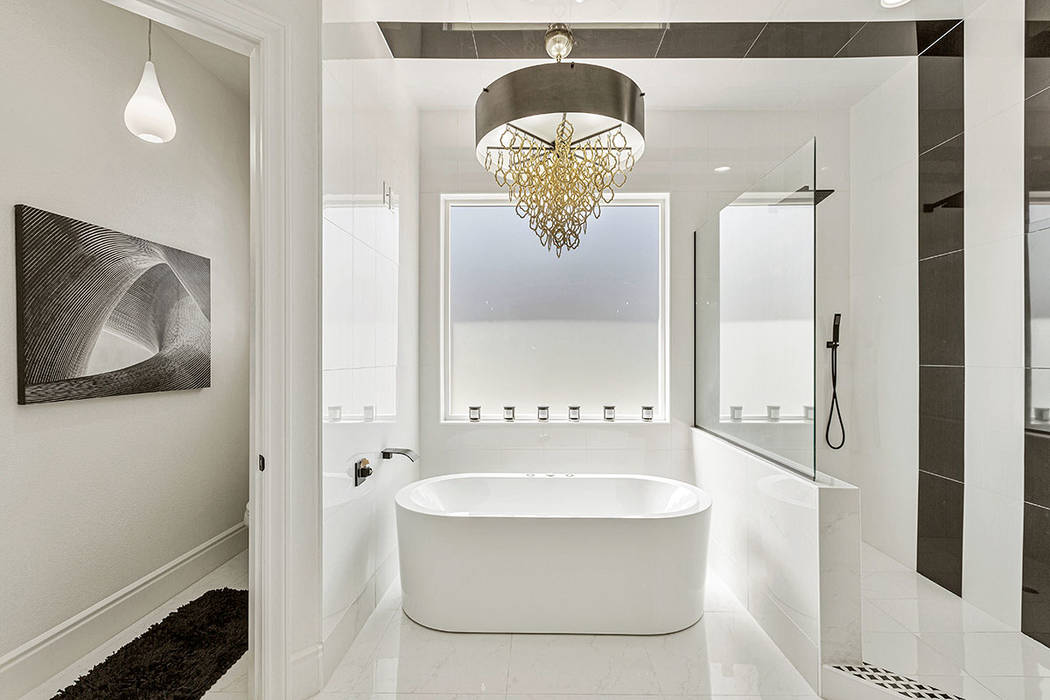 The master bath features a custom-made Roman tub imported from Italy. (Red Luxury Real Estate)