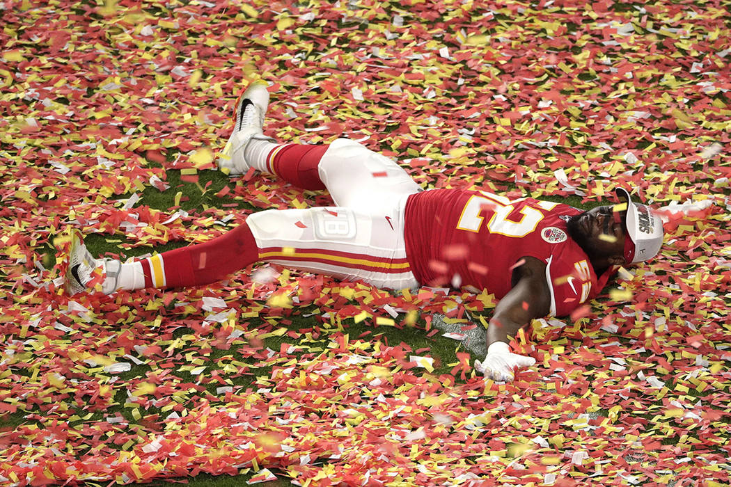 Kansas City Chiefs' Demone Harris (52) plays with the confetti, at the end of the NFL Super Bow ...