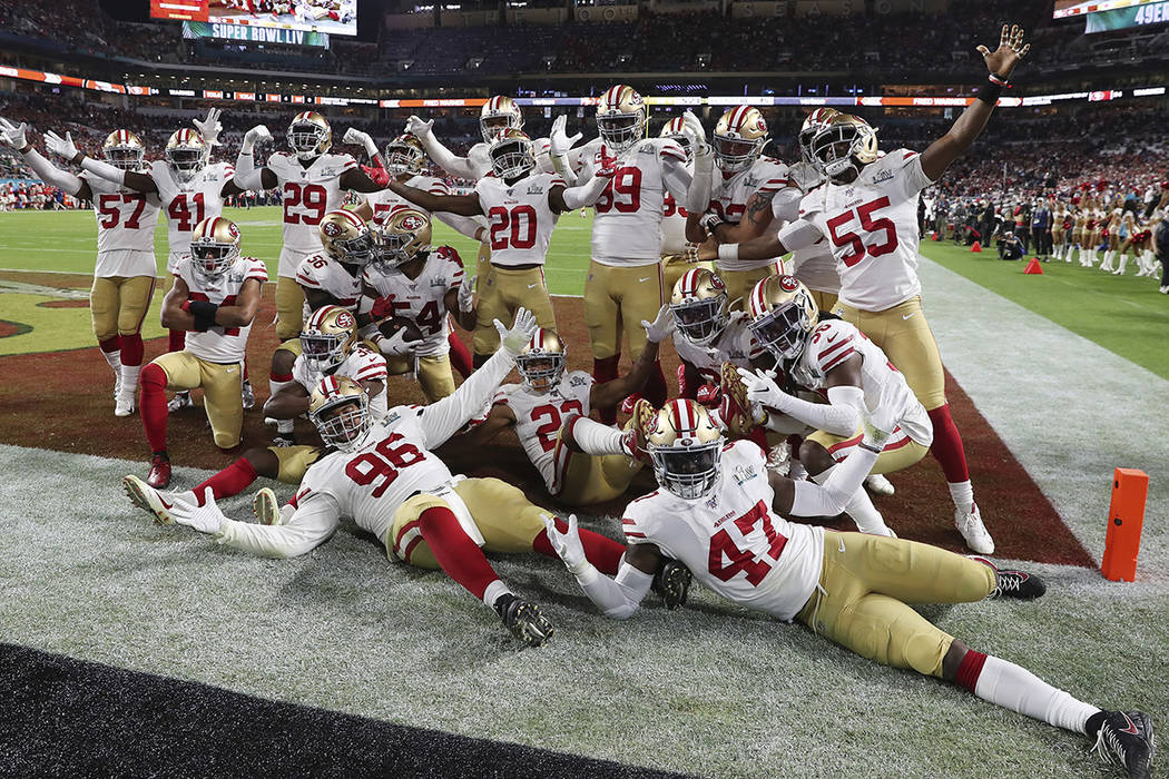 San Francisco 49ers celebrate after middle linebacker Fred Warner (54) intercepted a pass in th ...