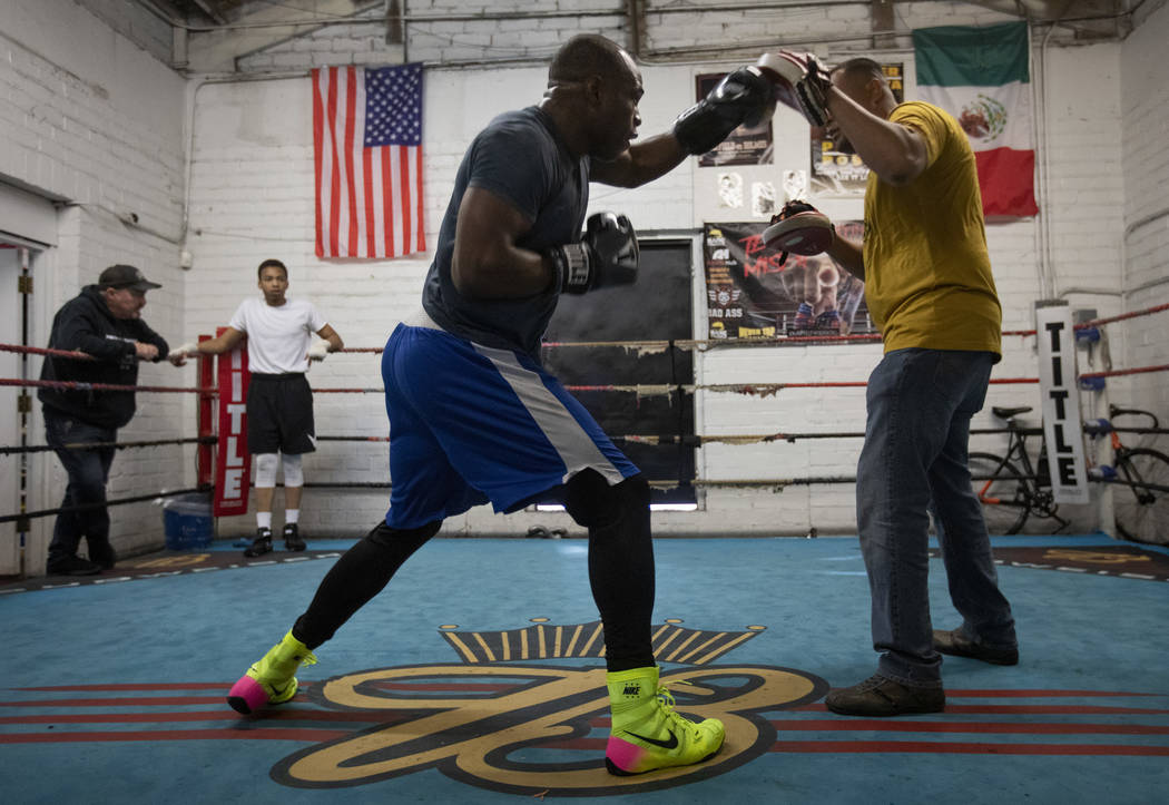 Heavyweight boxer Rubens Nicolas, left, boxes with private trainer Eddie Sanchez, right, on Fri ...