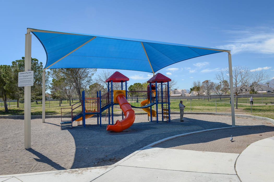 Residents enjoy a sunny afternoon at Woofter Park in Las Vegas, Monday, March 18, 2019. (Caroli ...