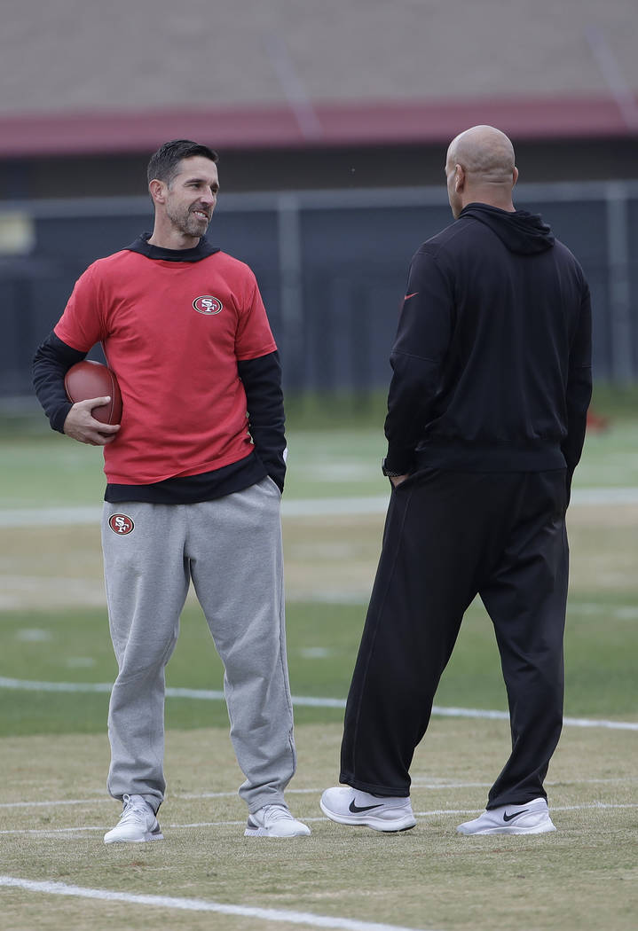 San Francisco 49ers head coach Kyle Shanahan, left, talks with defensive coordinator Robert Sal ...