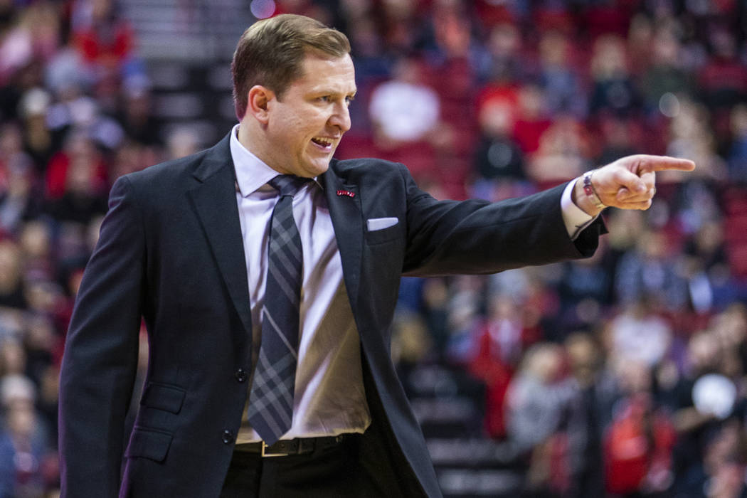 UNLV Rebels head coach T.J.Otzelberger directs his players on the court versus the New Mexico L ...