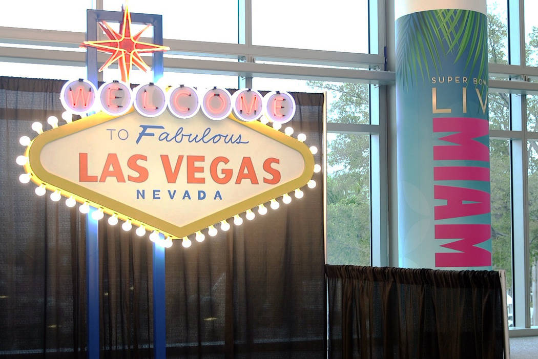 A replica of the Welcome to Las Vegas sign on display at the NFL Experience at the Miami Beach ...