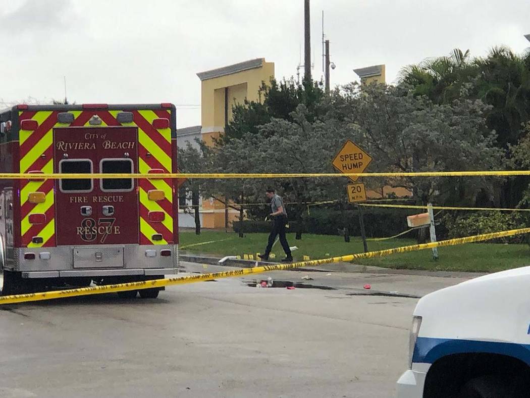 Police tape surrounds an area outside the Victory City Church in Riviera Beach, Fla., on Saturd ...