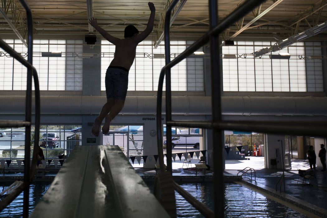 Isaiah Harvey-Miranda, 12, of Henderson, jumps from the high-dive at Heritage Park Aquatic Comp ...