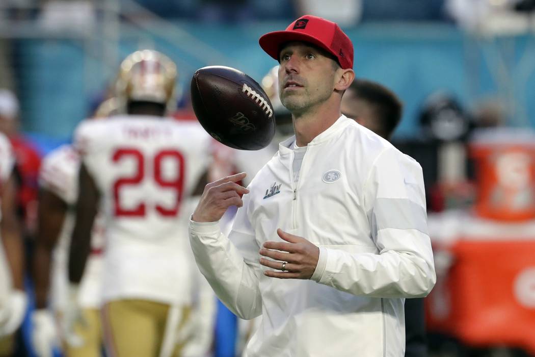 San Francisco 49ers head coach Kyle Shanahan watches during as the team warms up before the NFL ...