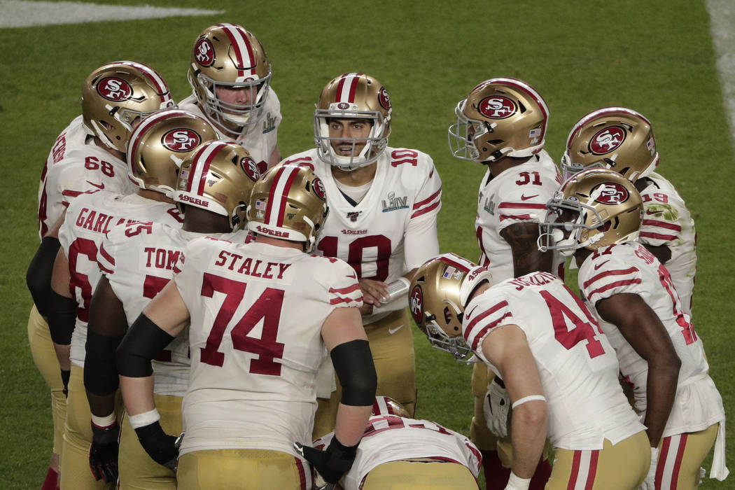 San Francisco 49ers quarterback Jimmy Garoppolo (10) talks to his team on the field, during the ...