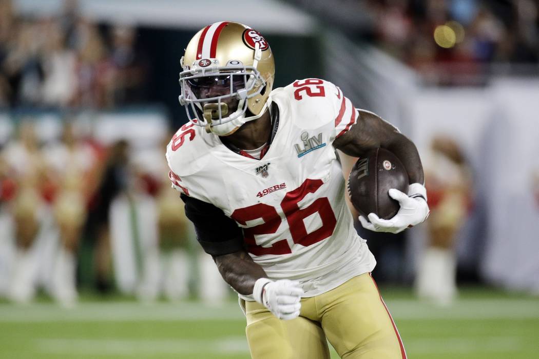 San Francisco 49ers' Tevin Coleman (26) runs against the Kansas City Chiefs during the first ha ...