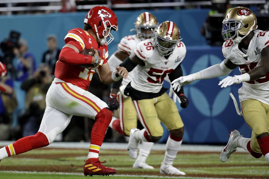 Kansas City Chiefs quarterback Patrick Mahomes runs for a touchdown against the San Francisco 4 ...