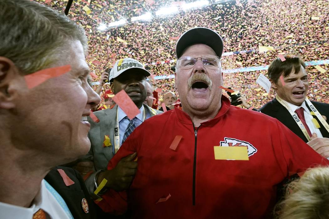 Kansas City Chiefs Chairman Clark Hunt, left, and head coach Andy Reid celebrate after defeatin ...