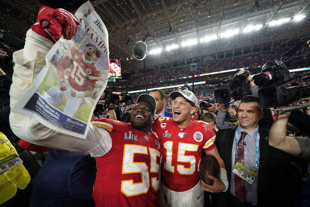 Kansas City Chiefs' Frank Clark, left, and Patrick Mahomes celebrate after defeating the San Fr ...