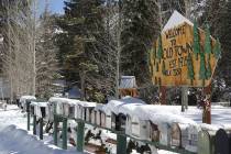 Mailboxes in Old Town on Mount Charleston stand in a snow drift in February 2019. (Michael Quin ...