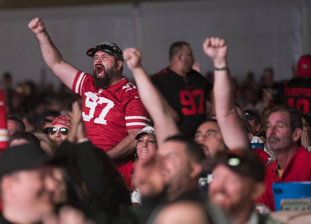The crowd cheers at a watch party for Super Bowl LIV at the Downtown Las Vegas Events Center in ...