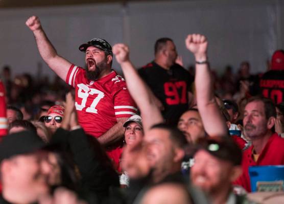 The crowd cheers at a watch party for Super Bowl LIV at the Downtown Las Vegas Events Center in ...