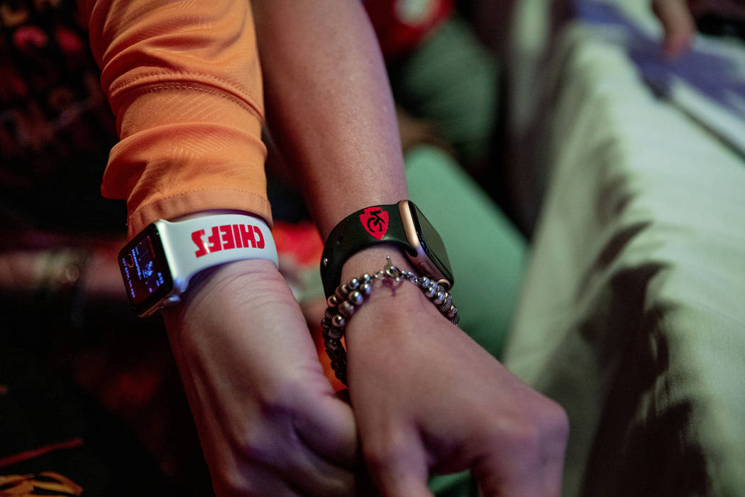 Kansas City Chiefs' fans display their watch bands as they attend a watch party of the Super Bo ...