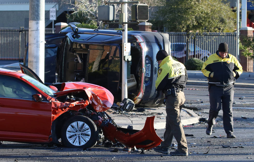 Metropolitan Police Department officers investigate a two-vehicle crash at South Jones Boulevar ...