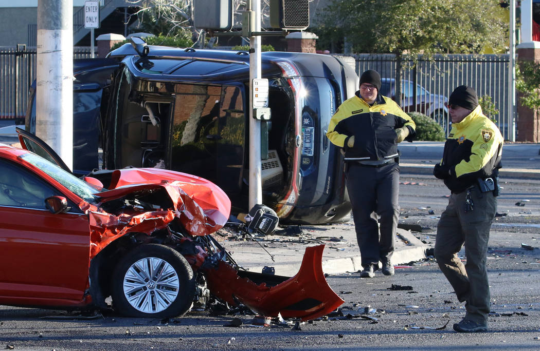 Metropolitan Police Department officers investigate a two-vehicle crash at South Jones Boulevar ...