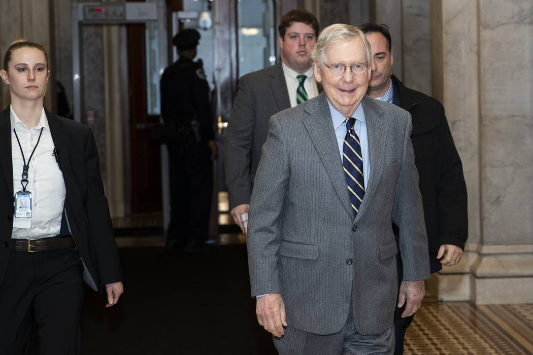 Senate Majority Leader Mitch McConnell of Ky., arrives on Capitol Hill, Monday, Feb. 3, 2020 in ...