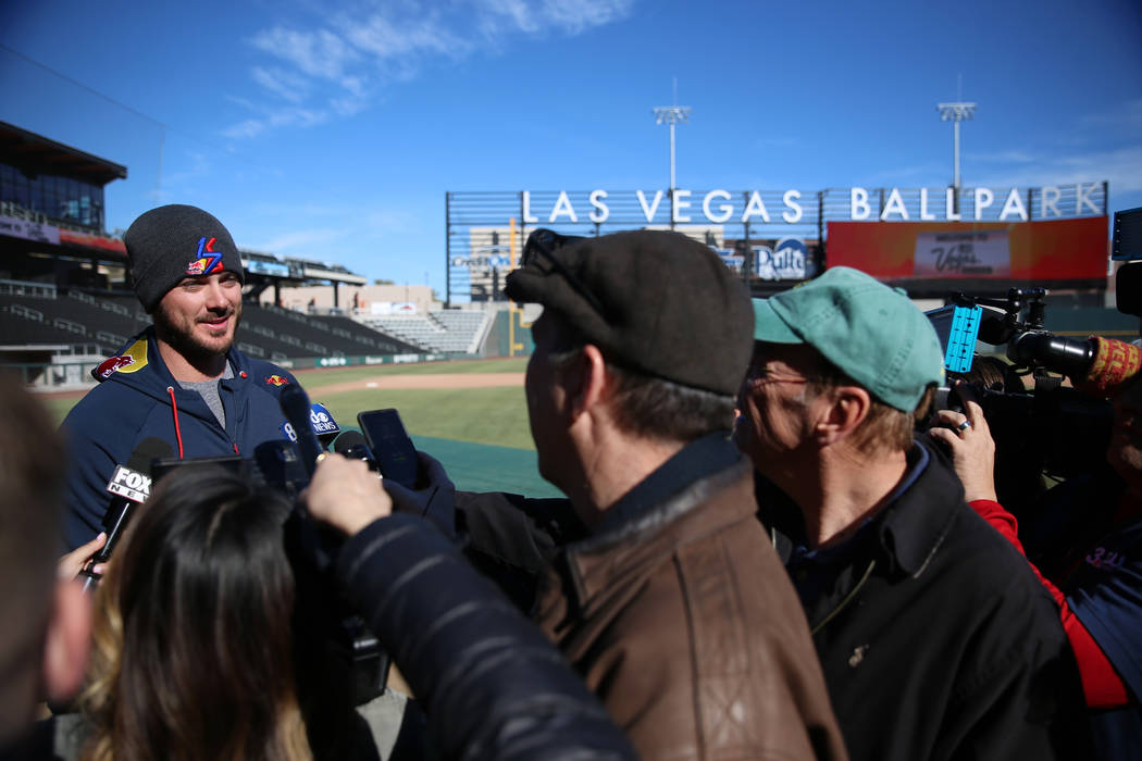 Chicago Cubs player Kris Bryant holds is interviewed during a live batting practice event at La ...