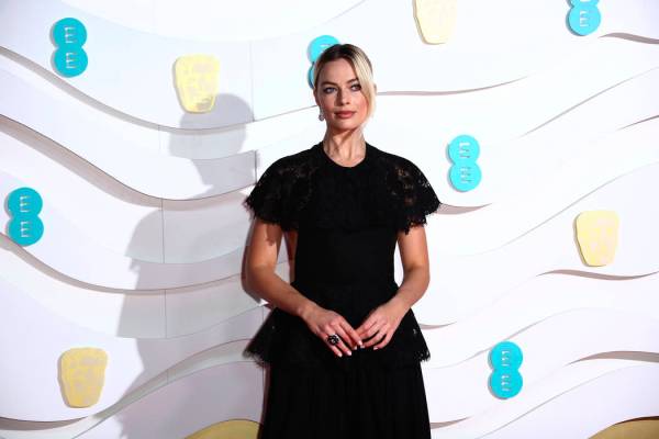 Margot Robbie poses for photographers upon arrival at the Bafta Film Awards, in central London, ...