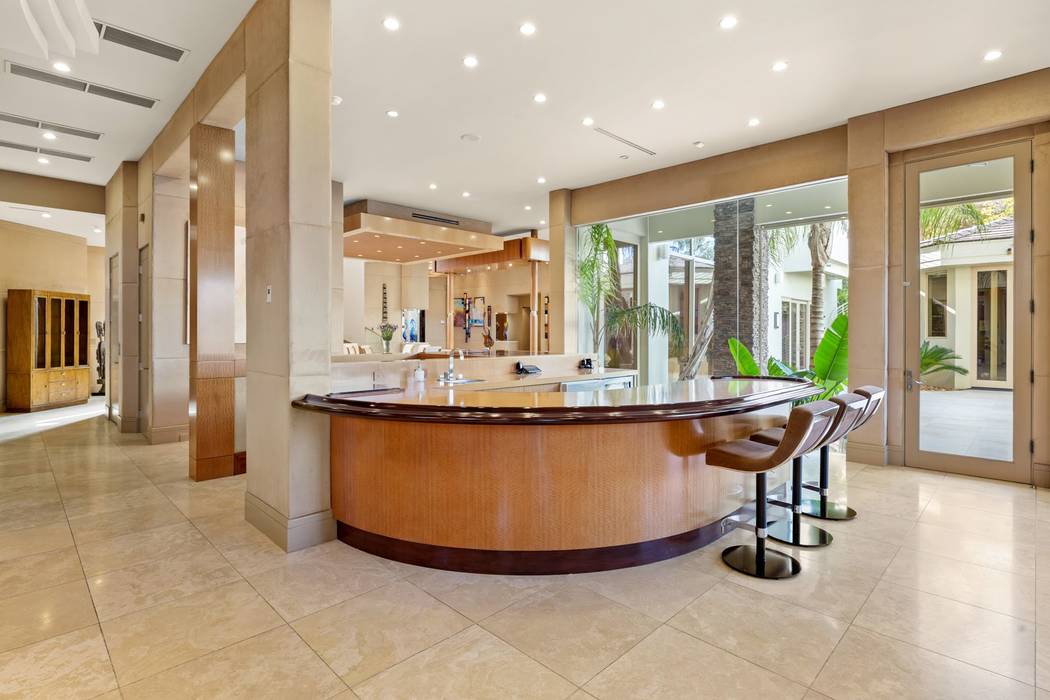 A circular island is near the kitchen. (Ivan Sher Group)