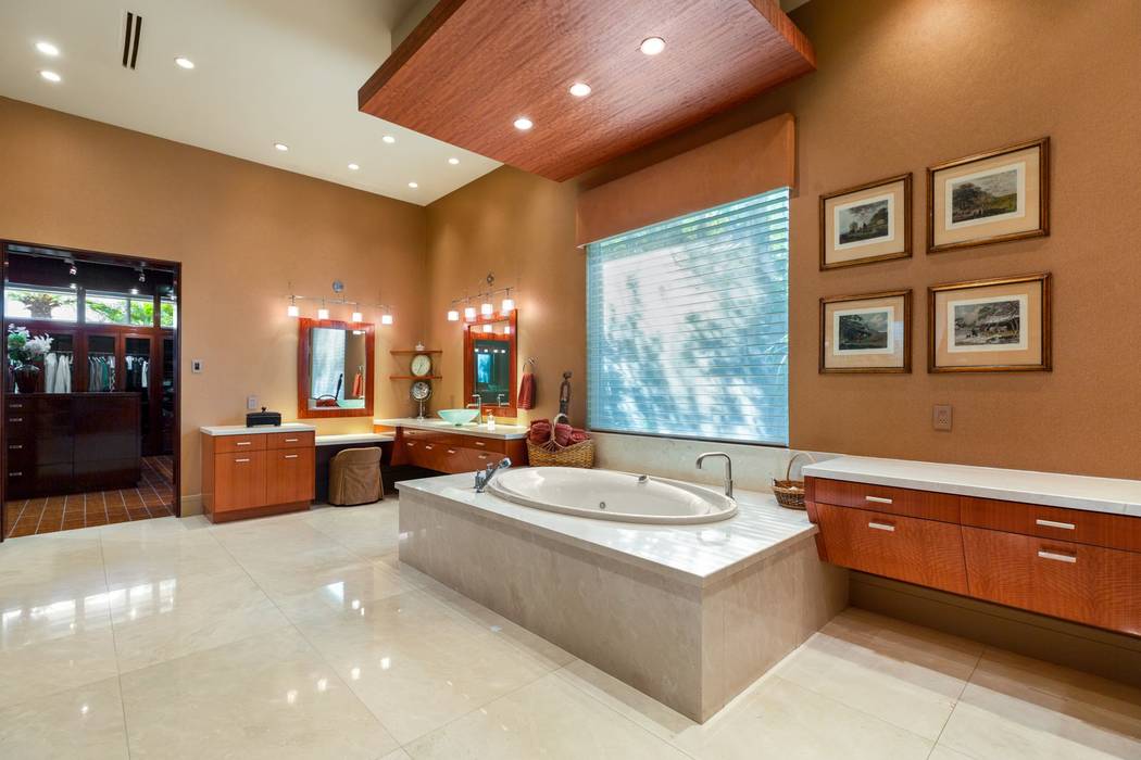 The spa-like master bath features granite counters and flooring. (Ivan Sher Group)