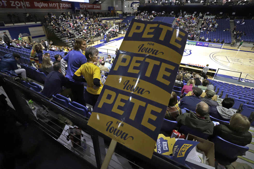 People caucusing for Pete Buttigieg begin to fill his section of the Knapp Center on the Drake ...