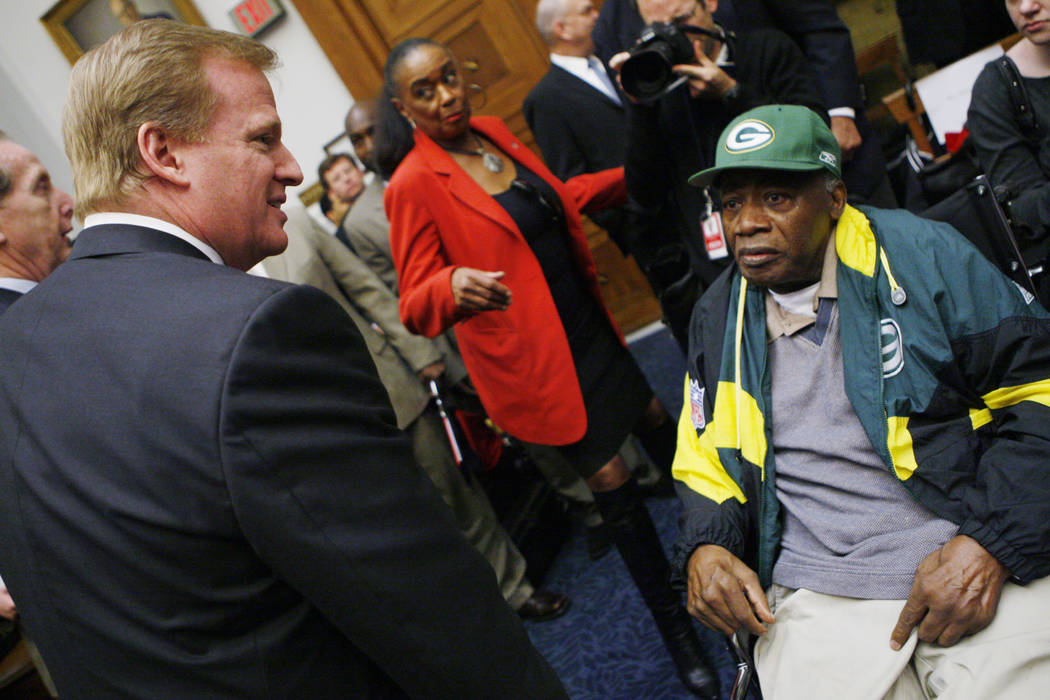 FILE - In thisWednesday, Oct. 28, 2009 file photo, NFL Commissioner Roger Goodell, left, meets ...