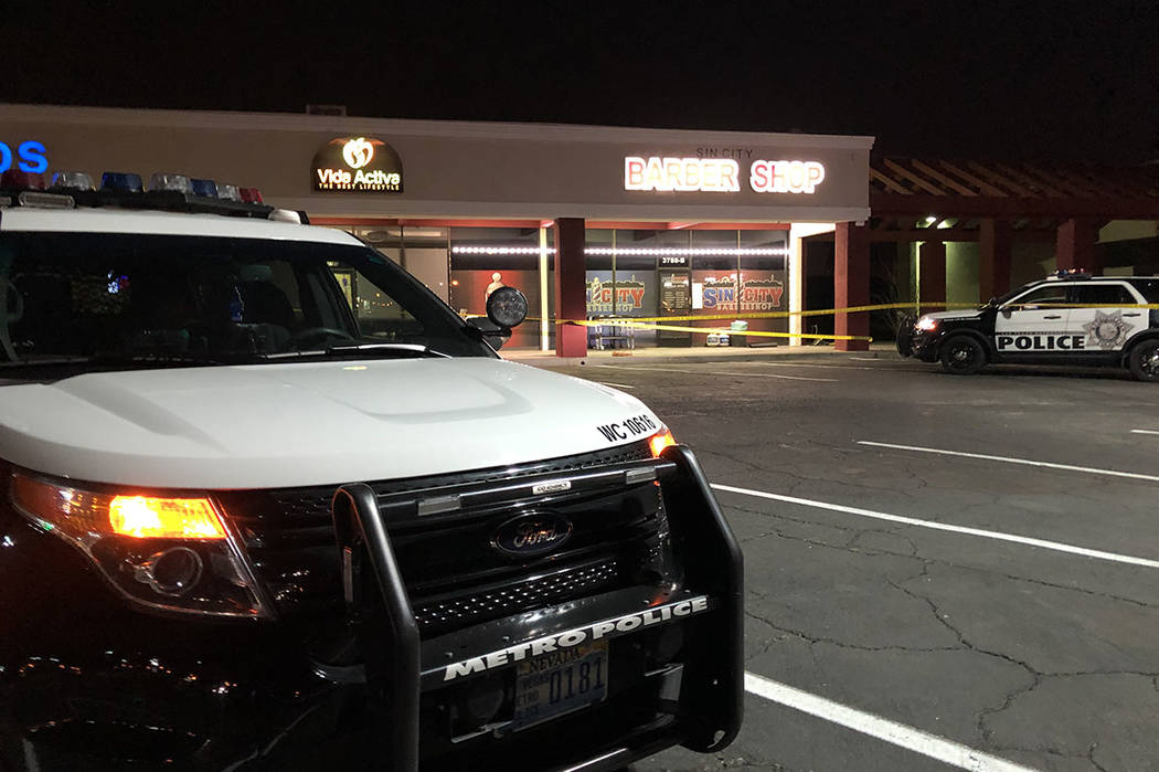 Police investigate the scene of a fatal shooting near Sandhill and Desert Inn roads in Las Vega ...