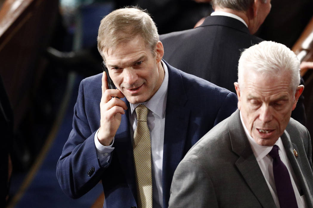 Rep. Jim Jordan, R-Ohio, talks on the phone before President Donald Trump delivers his State of ...