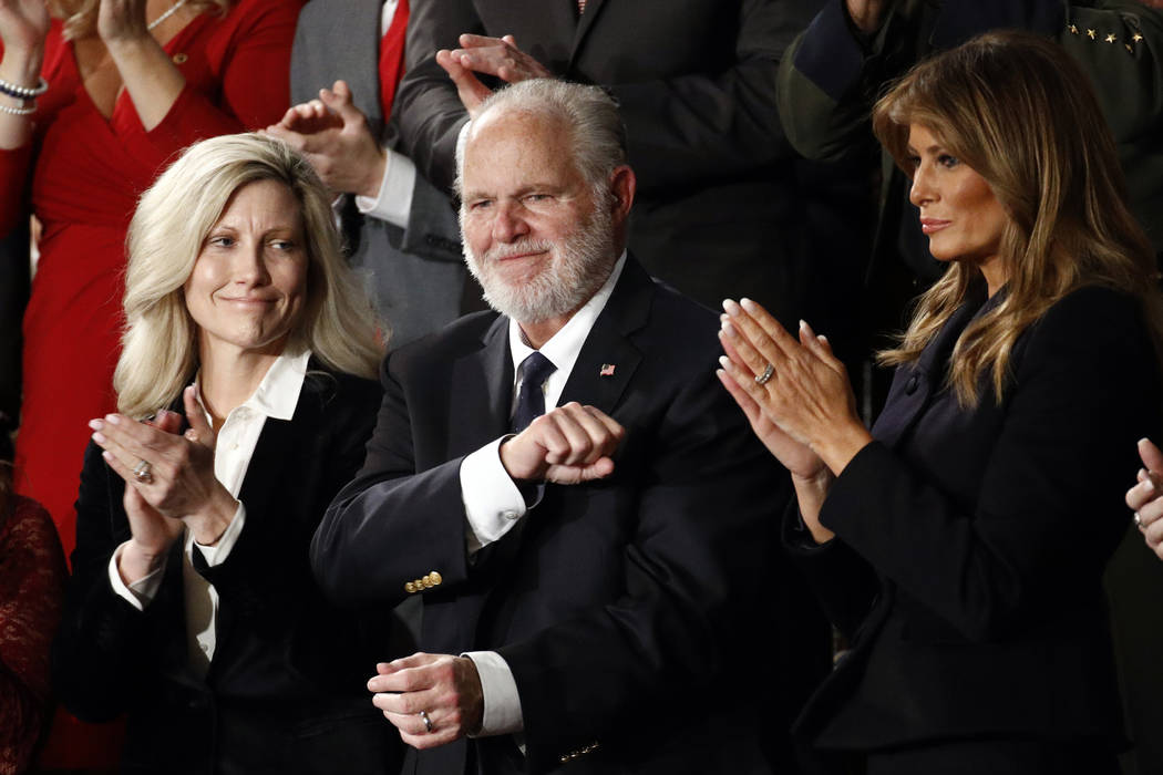 Rush Linbaugh reacts as first Lady Melania Trump, and his wife Kathryn, applaud, as President D ...