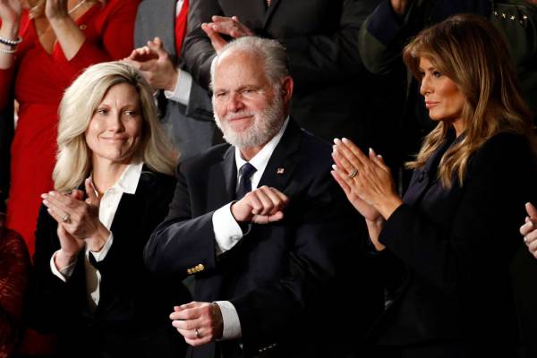 Rush Linbaugh reacts as first Lady Melania Trump, and his wife Kathryn, applaud, as President D ...