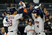 Houston Astros' George Springer, right, celebrates with Robinson Chirinos after his three-run h ...