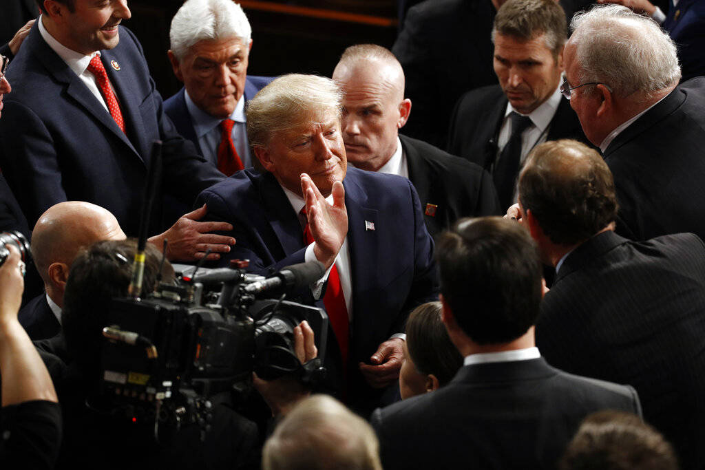President Donald Trump waves after delivering his State of the Union address to a joint session ...