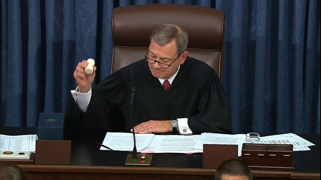In this image from video, presiding officer Chief Justice of the United States John Roberts gav ...