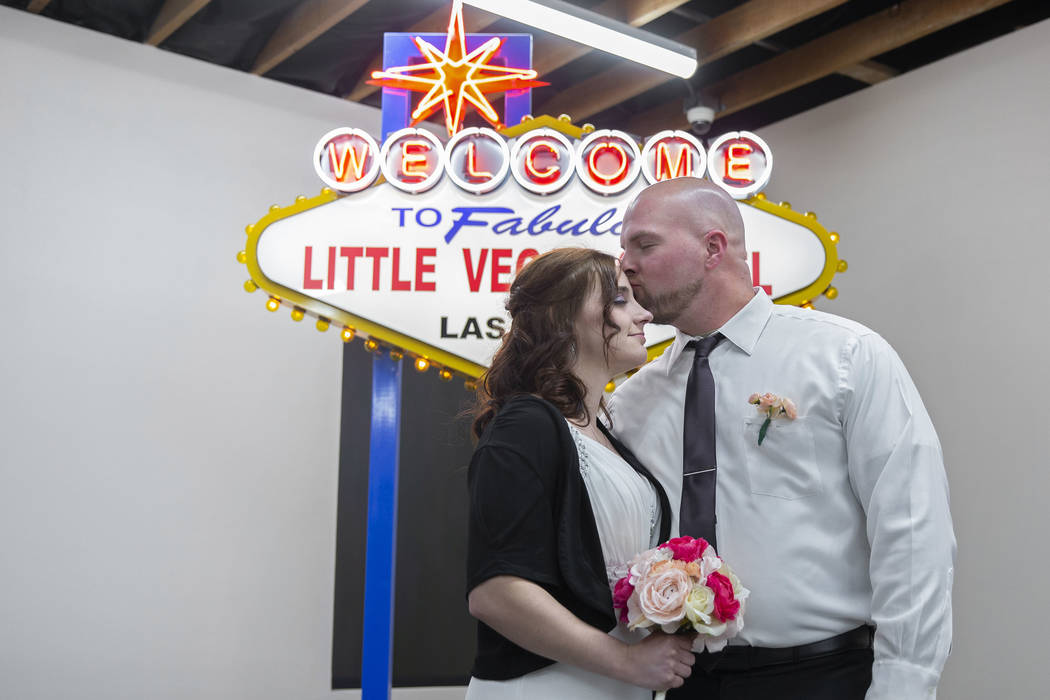 Jordan Williams, right, 30, and Amanda Schild, 33, from Rochester, Minn., tie the knot at The L ...