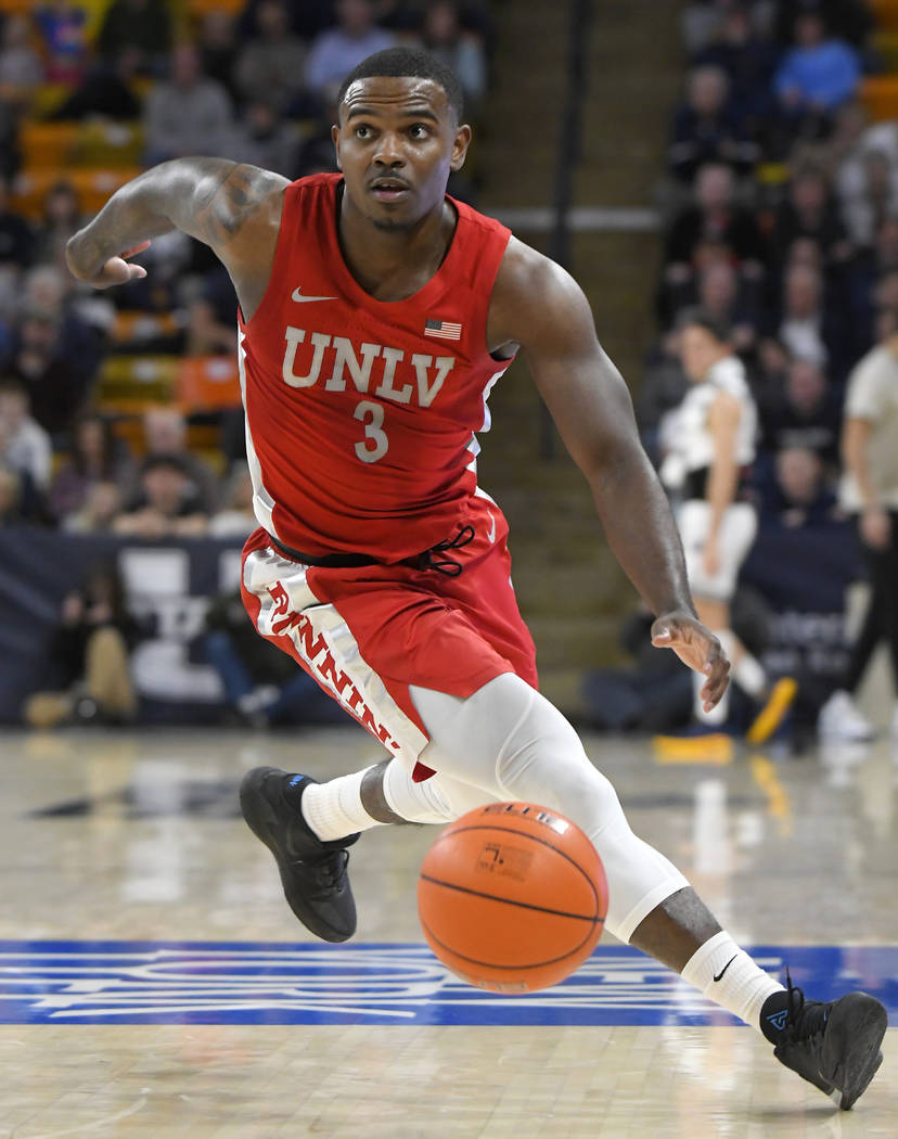 UNLV guard Marvin Coleman (31) fouls Utah State forward Justin Bean during the second half of a ...
