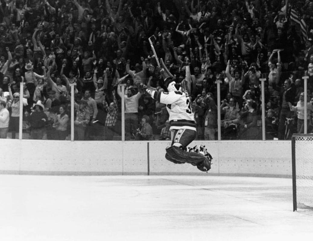FILE -In this Feb. 22, 1980 file photo, U.S. Goalie James Craig leaps high in the air at the fi ...