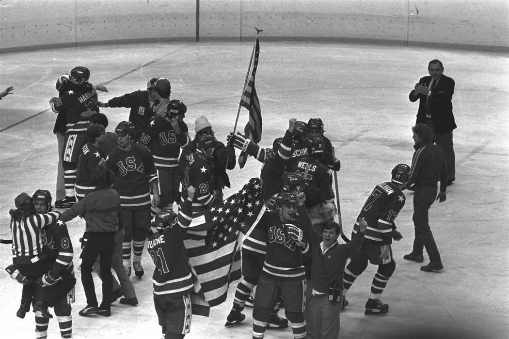FILE --In this Feb. 24, 1980 file photo, members of the U.S. Olympic ice hockey team whoop it u ...