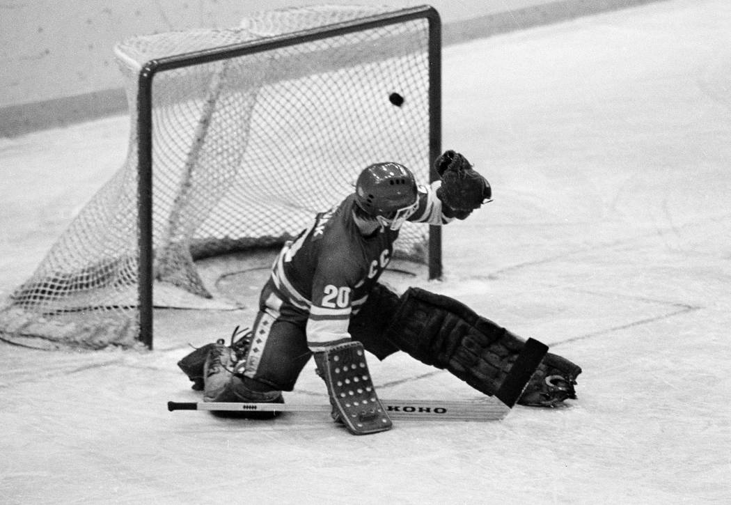 FILE - In this 1980 file photo, Soviet goalie Vladislav Tretiak allows a goal by the U.S. team ...