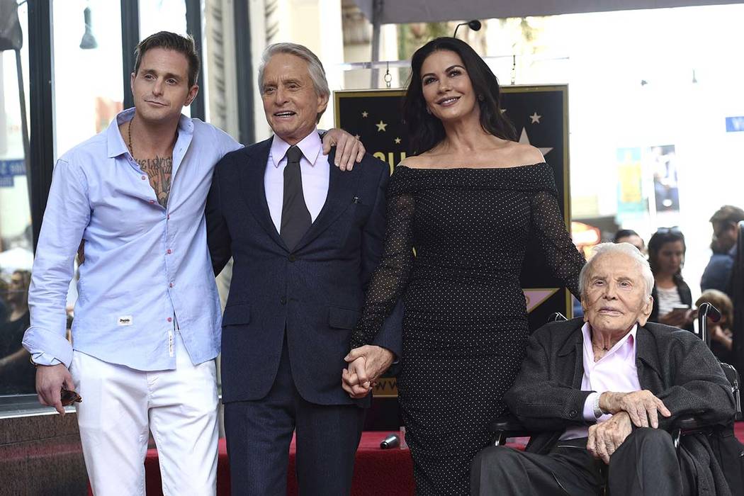 In this Nov. 6, 2018, file photo, Honoree and actor Michael Douglas, second left, poses with hi ...