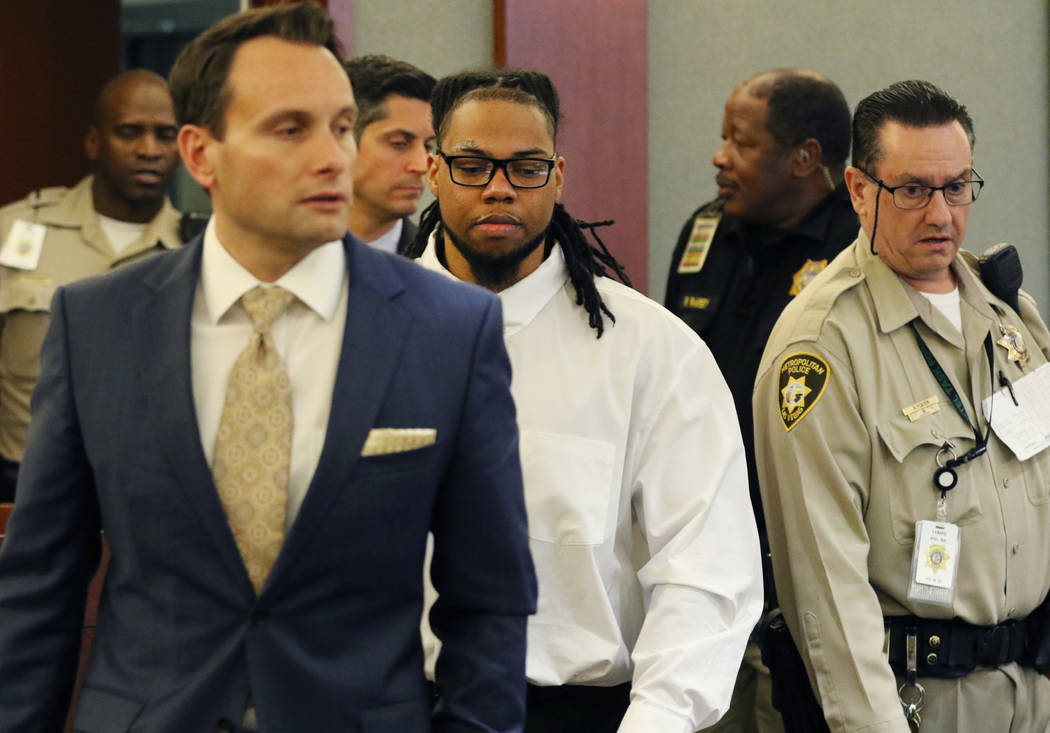 Ray Charles Brown, center, who was found guilty for fatally shooting Lee's Discount Liquor cler ...