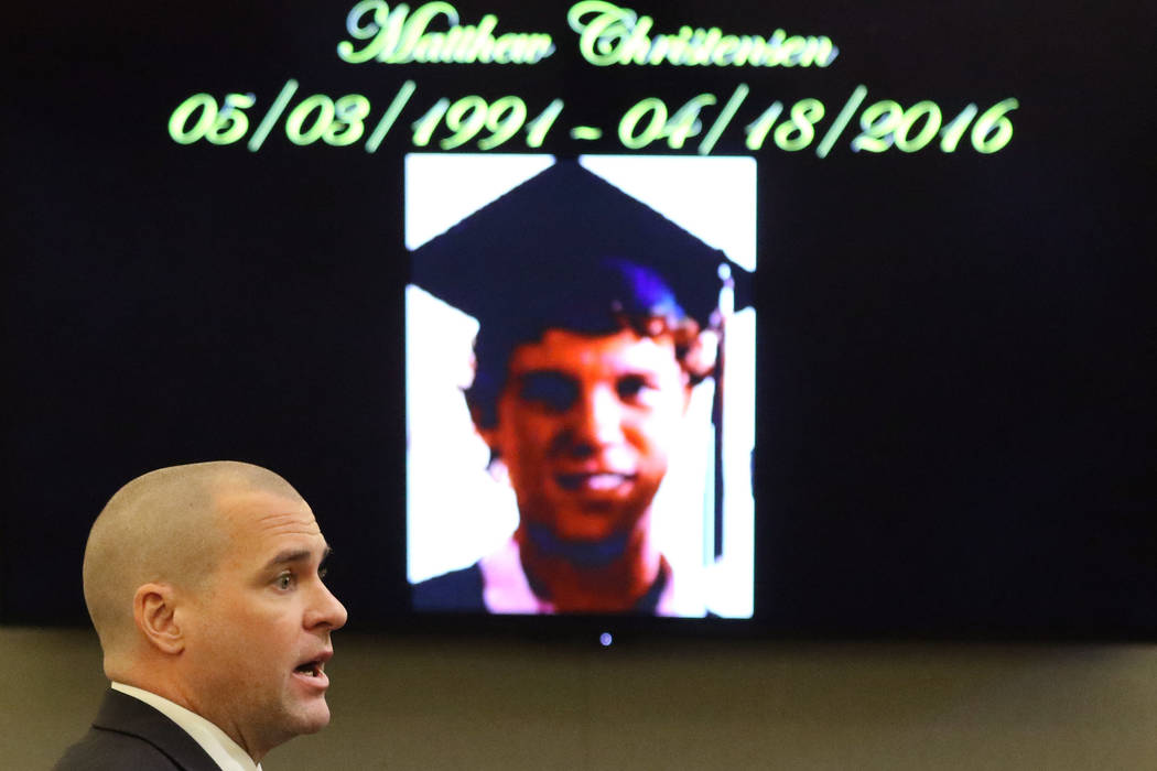 A photograph of murder victim Matthew Christensen is displayed as prosecutor John Giordani addr ...