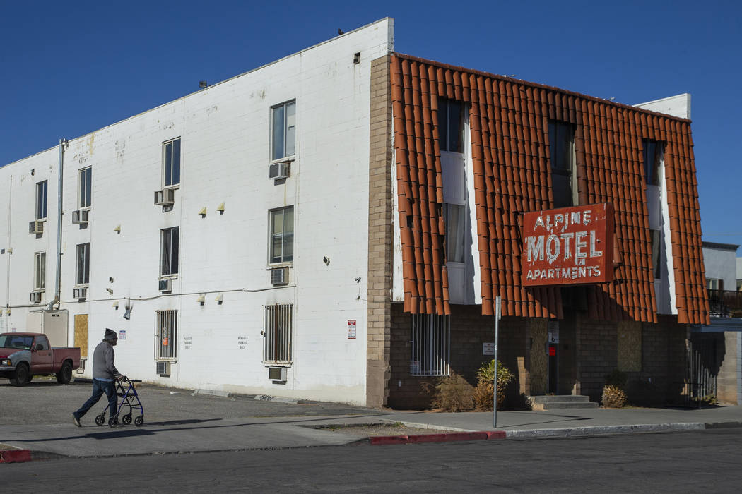 Earl Betts walks over to pay his respects on a daily trek to the Alpine Motel Apartments on Jan ...