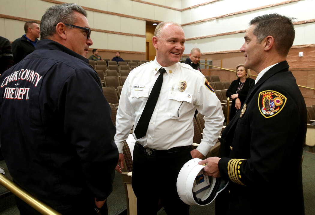 Outgoing Clark County Fire Department Chief Greg Cassell, center, visits with Capt. Warren Whit ...