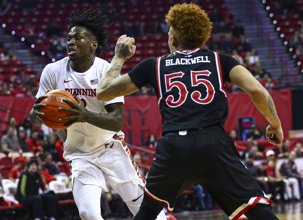 UNLV's Donnie Tillman (2) drives to the basket against Fresno State's Noah Blackwell (55) durin ...