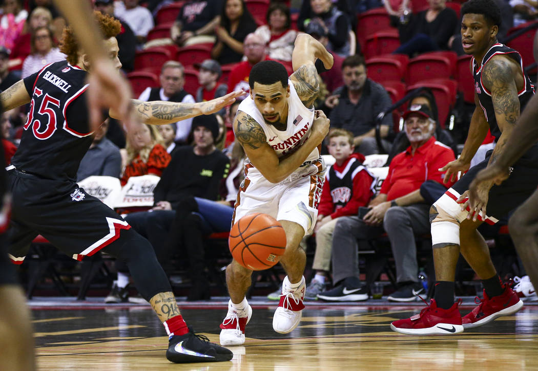UNLV's Elijah Mitrou-Long (55) chases after the ball against Fresno State's Noah Blackwell (55) ...