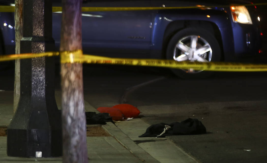 Clothes and other items on the ground at the scene of a shooting on Fremont Street between 14th ...